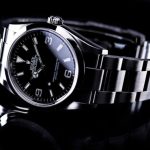 Rolex - silver and black round analog watch