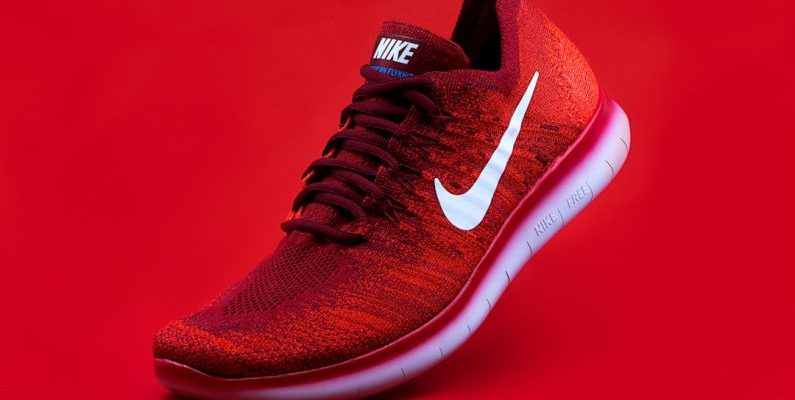 Footwear - unpaired red Nike sneaker