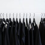 Minimalism Fashion - black clothes hanged in rack
